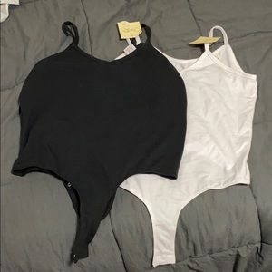 set of 2 new bodysuits.